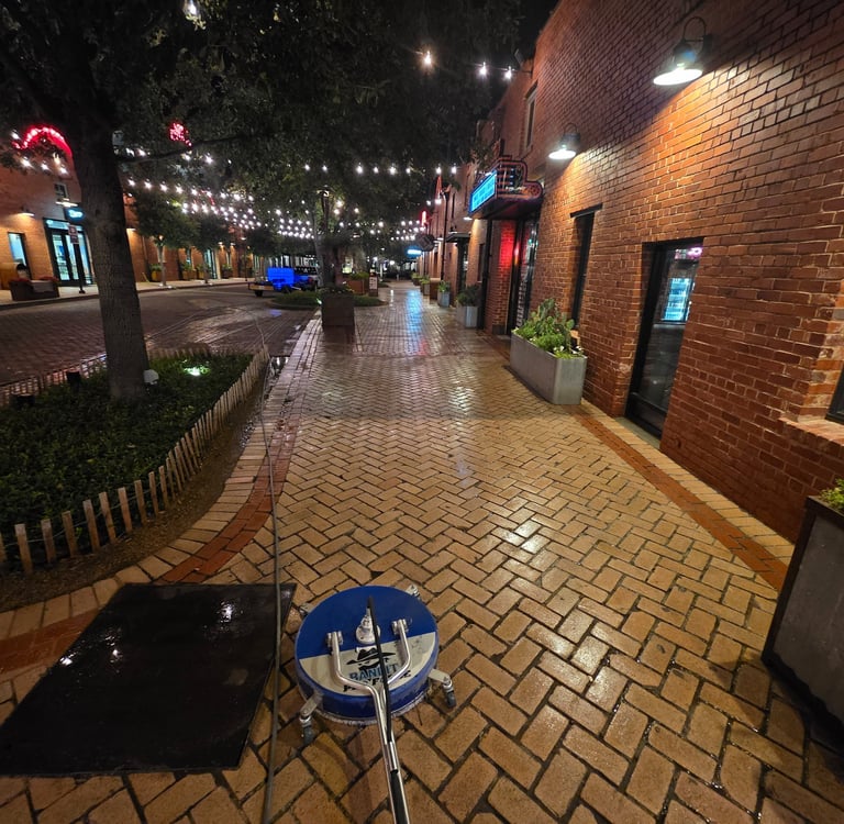 in the middle of pressure washing outside of a restaurant