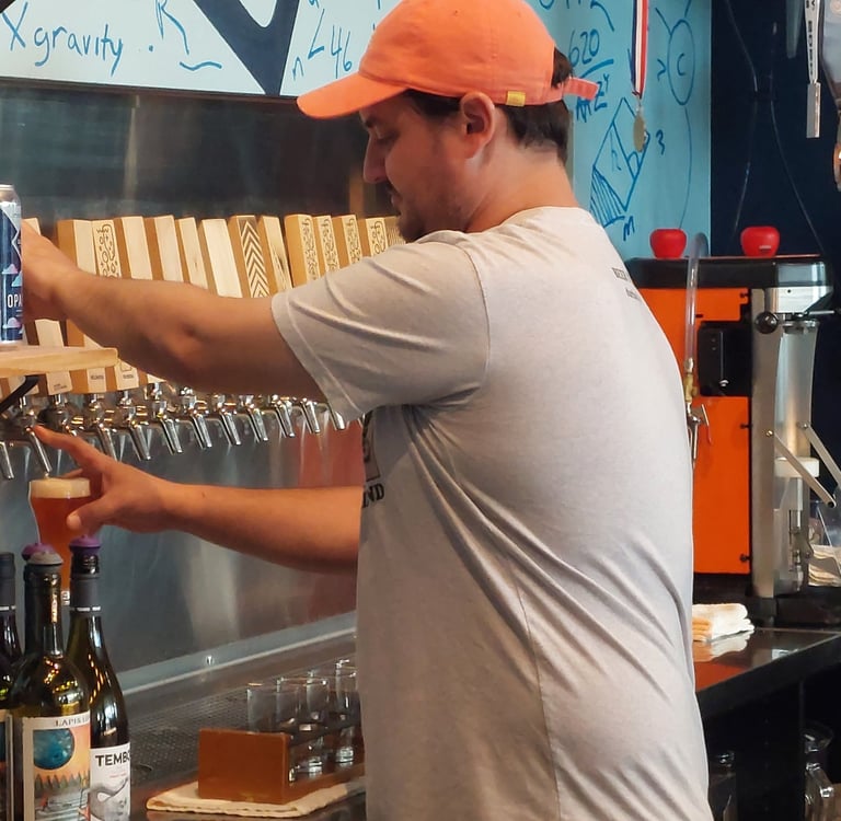 Man pouring a pint at The Glass Jug in Durham