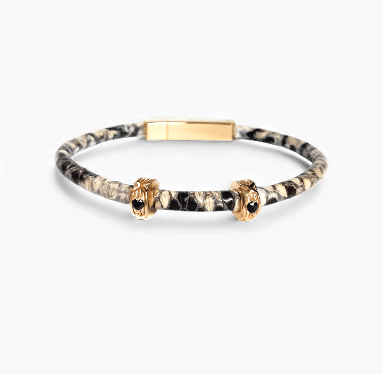 a snakeskin bracelet with a golden clasp