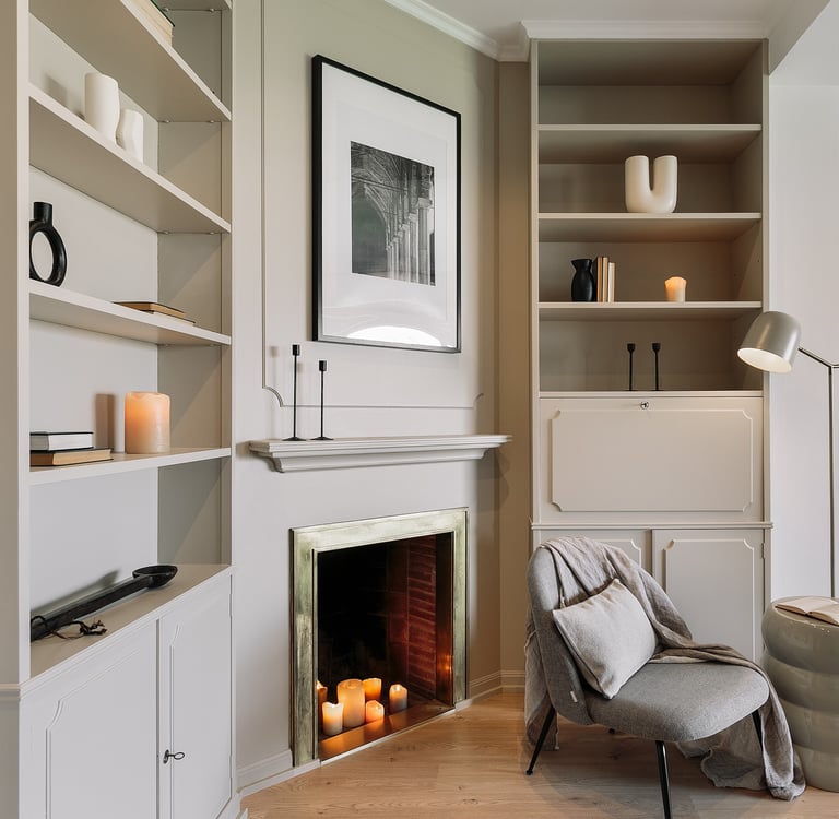 Living area with elegant decor, custom art, and calm beige tones, designed by SAVIA in Barcelona