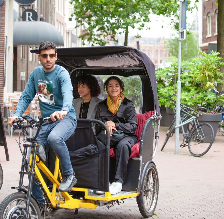 young latino ladies on bike taxi ride