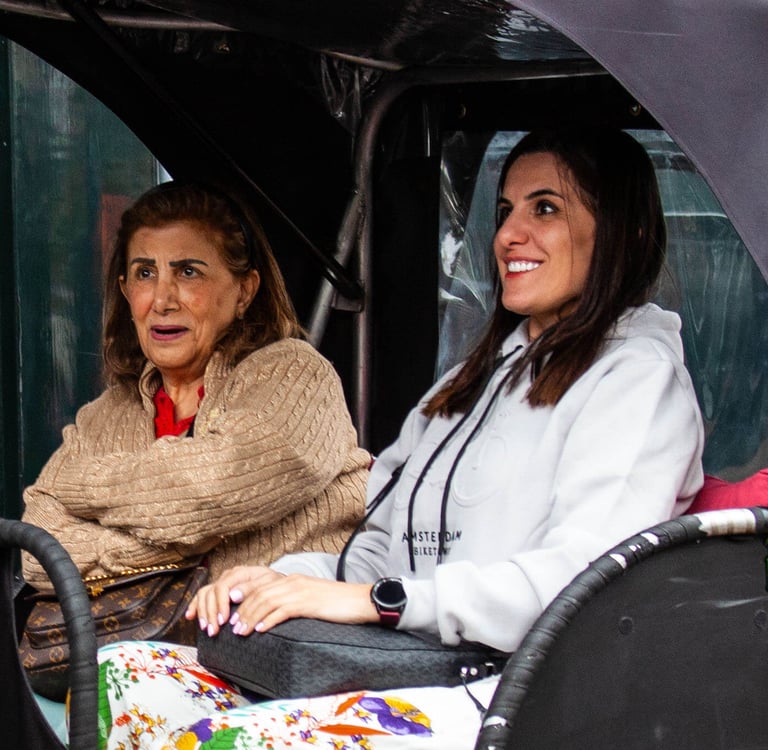 mother and daughter from oman on bike taxi