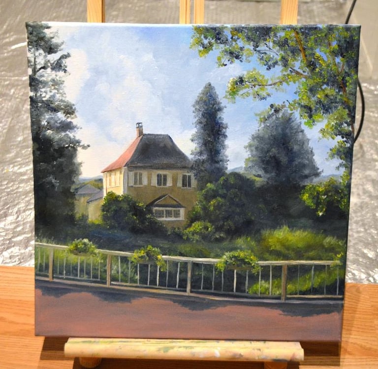 a painting of a house with a fenced adorned with hanging green plants
