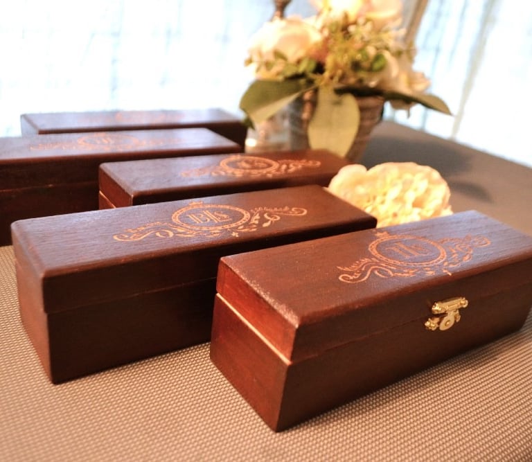 a bunch of wooden boxes with flowers in a vase