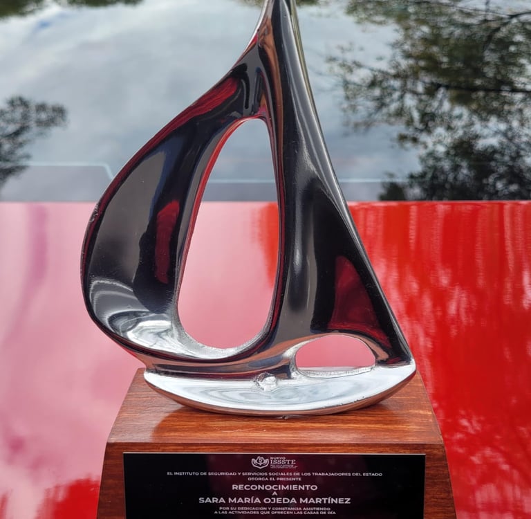 a sculpture of a sailboat on display in a museum
