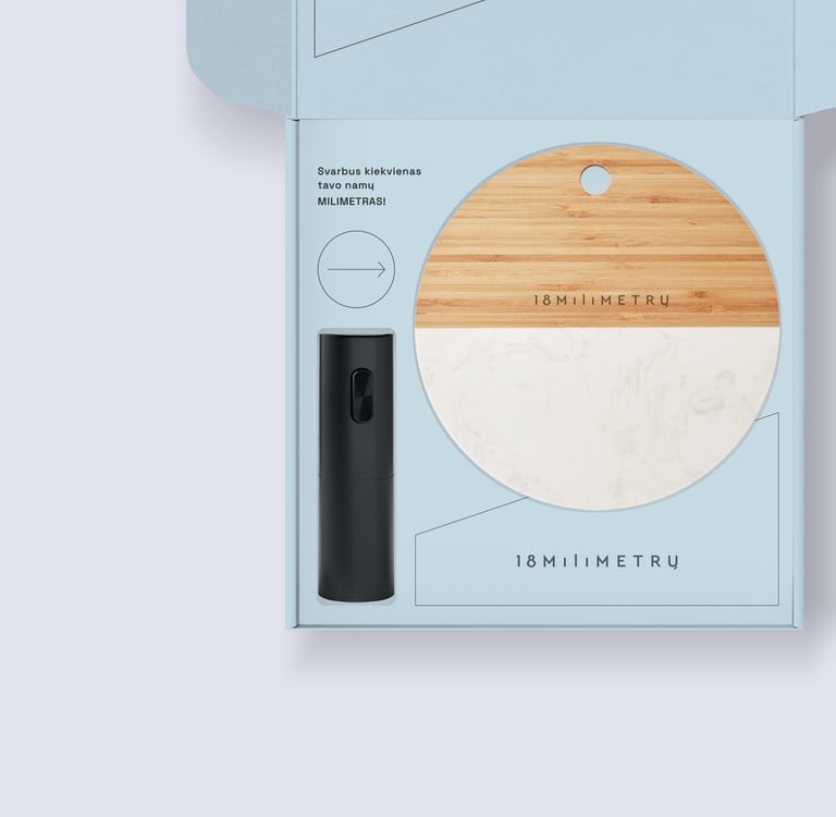 Luxury gift set featuring a marble and wood serving board and black wine opener in a blue box.