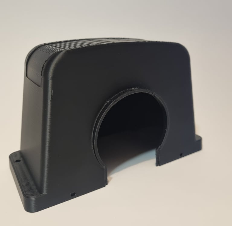 A black 3D printed plastic protective cover with a curved archway design on a white background.