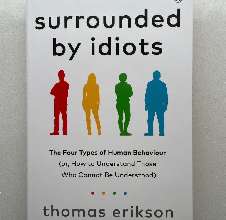 a book cover of Surrounded by idiots
