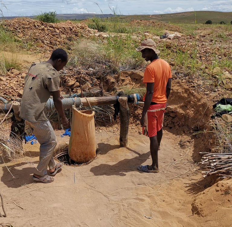 gemstone miners use winch to bring stones to surface