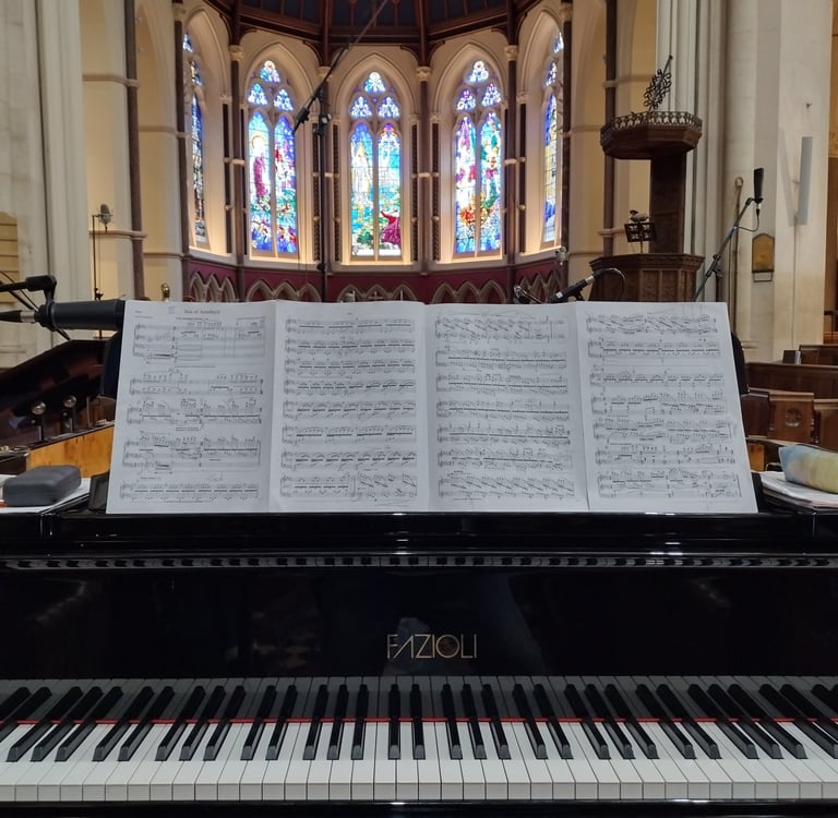 Photo of a grand piano in a chapel