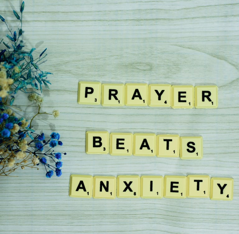 Scrabble letters spell out "prayer beats anxiety", a common misguided belief in religious circles