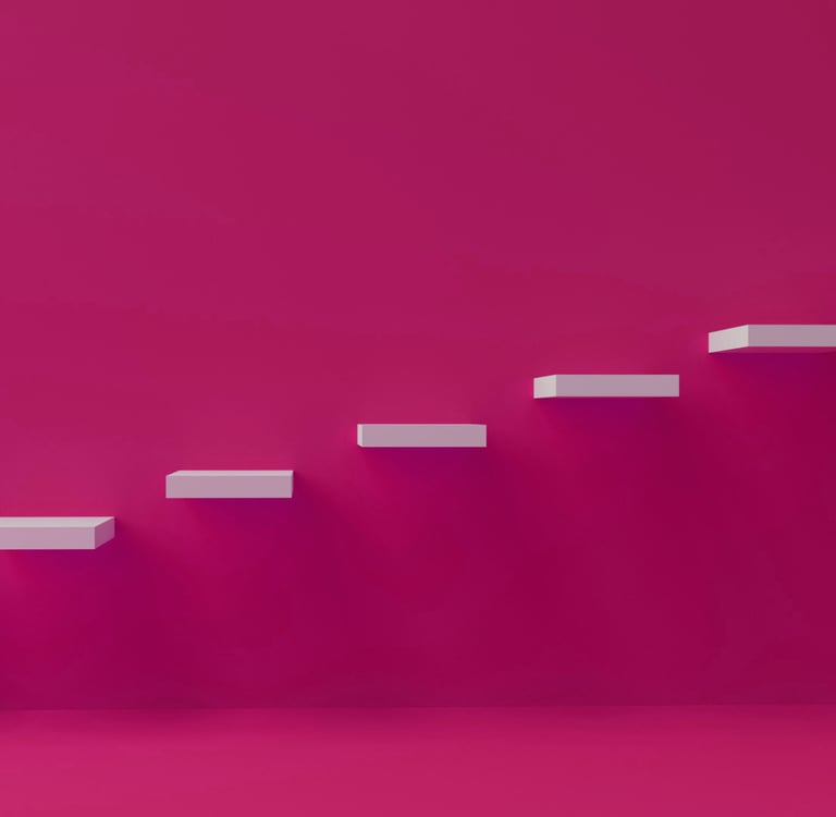 A set of stairs set into the wall against a brightly painted pink wall