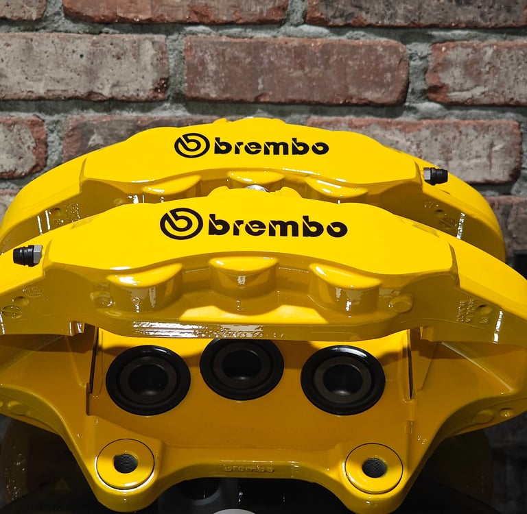 Jeep Trackhawk calipers restored in Signal Yellow powdercoat