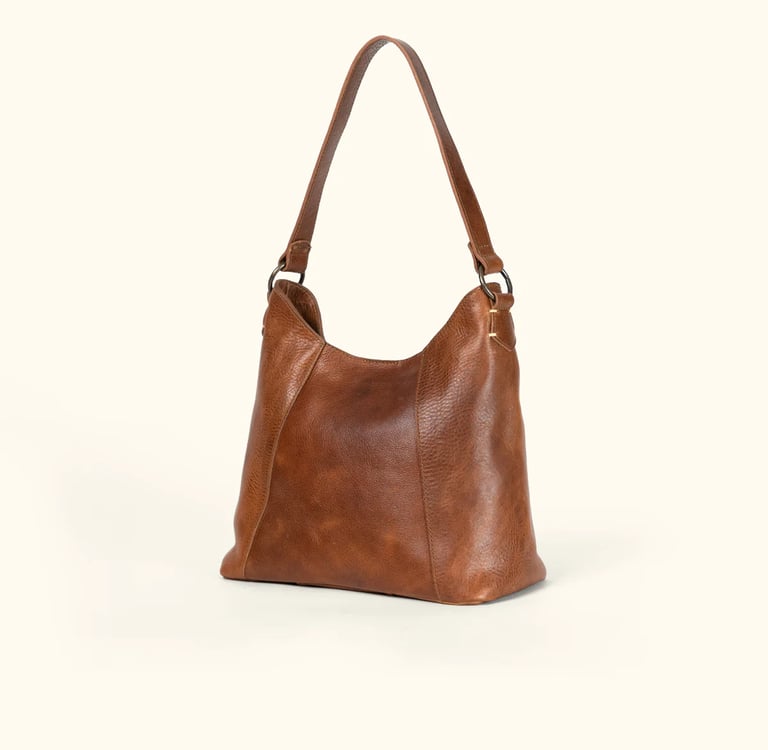 a brown leather handbag with a brown leather bag