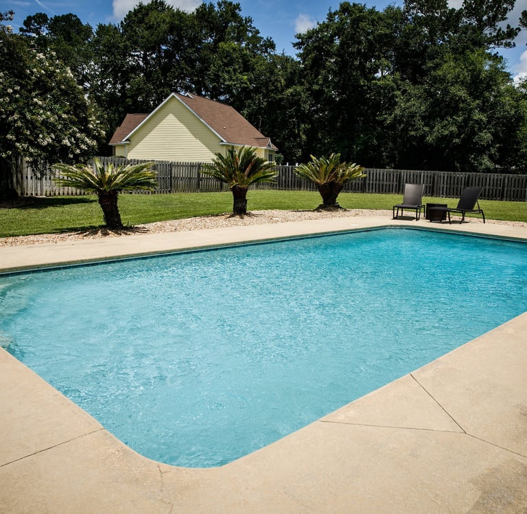 Concrete pool deck installation in St Petersburg Florida residential backyard