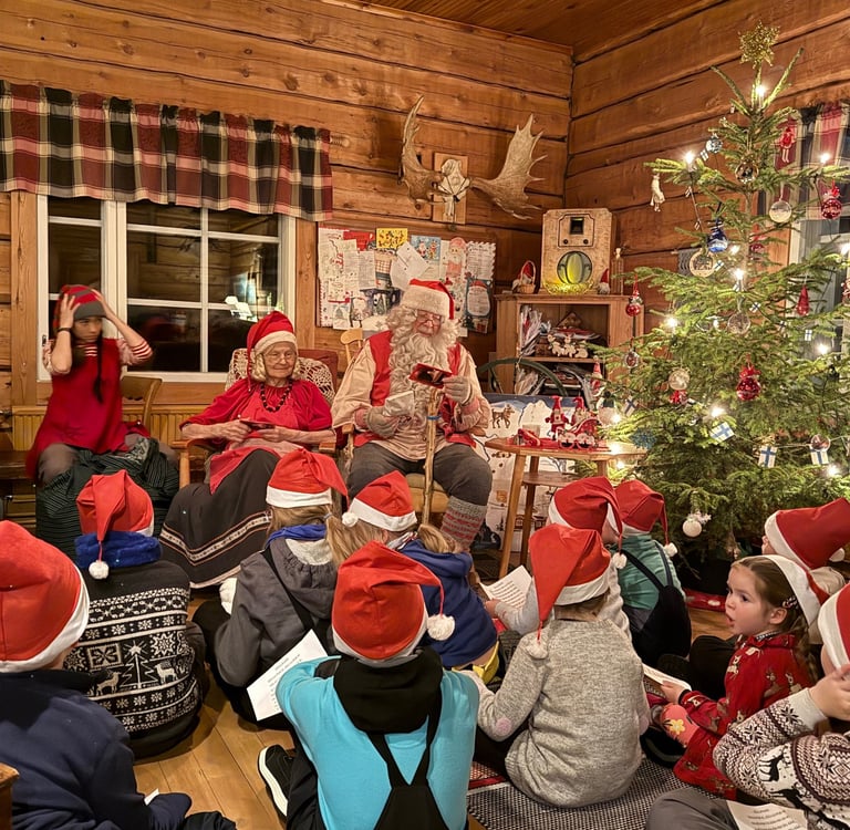 kids with santa in ruka village finland