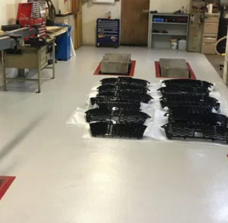 Microcement for an epoxy floor inside a professional body shop.