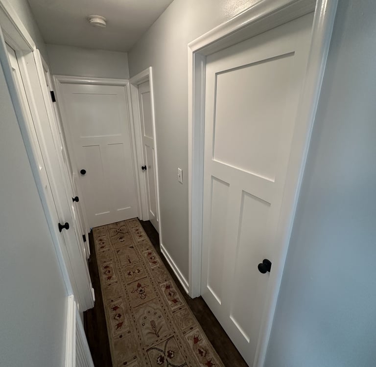 interior residential hallway with fresh white coat of paint