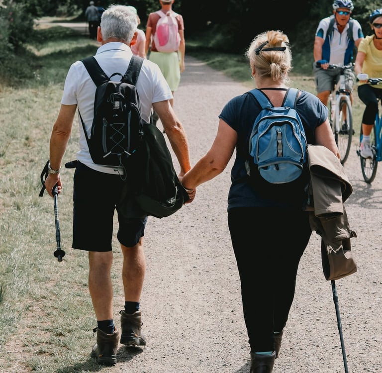 Older adults hiking together on a forest trail
