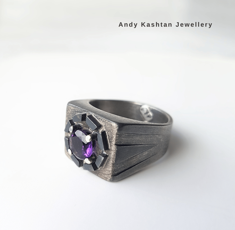 Handcrafted men's sterling silver signet ring featuring a purple amethyst gemstone and black accents.
