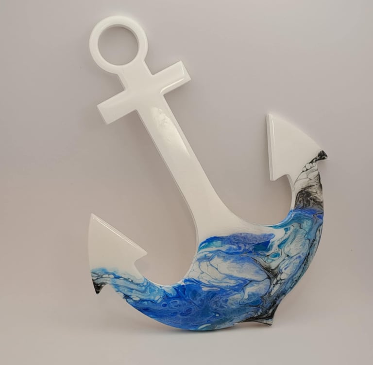 White nautical anchor wall decor with blue and white marble resin ocean wave art.