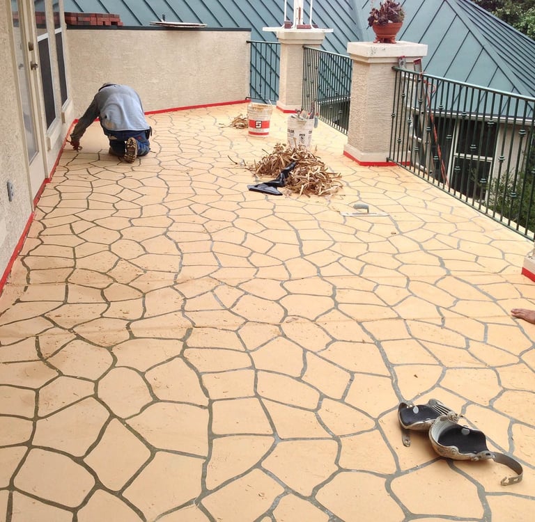 Stenciled concrete surface on baloney.