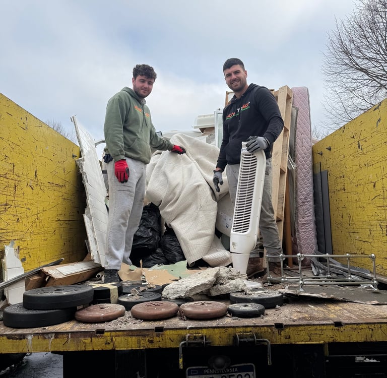 Alt Text: Junk removal crew loading a truck in Montgomery County.