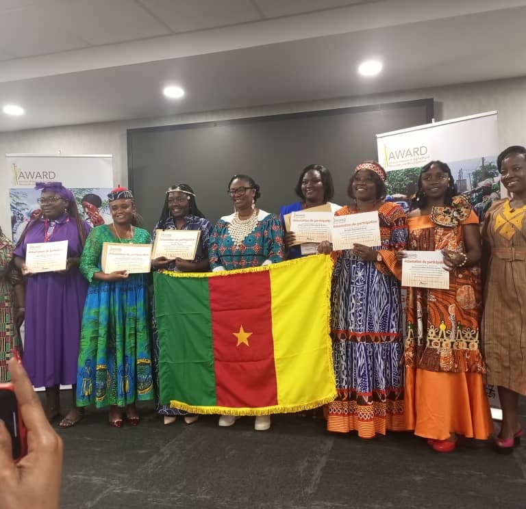 a group of people holding up certificates and holding certificates