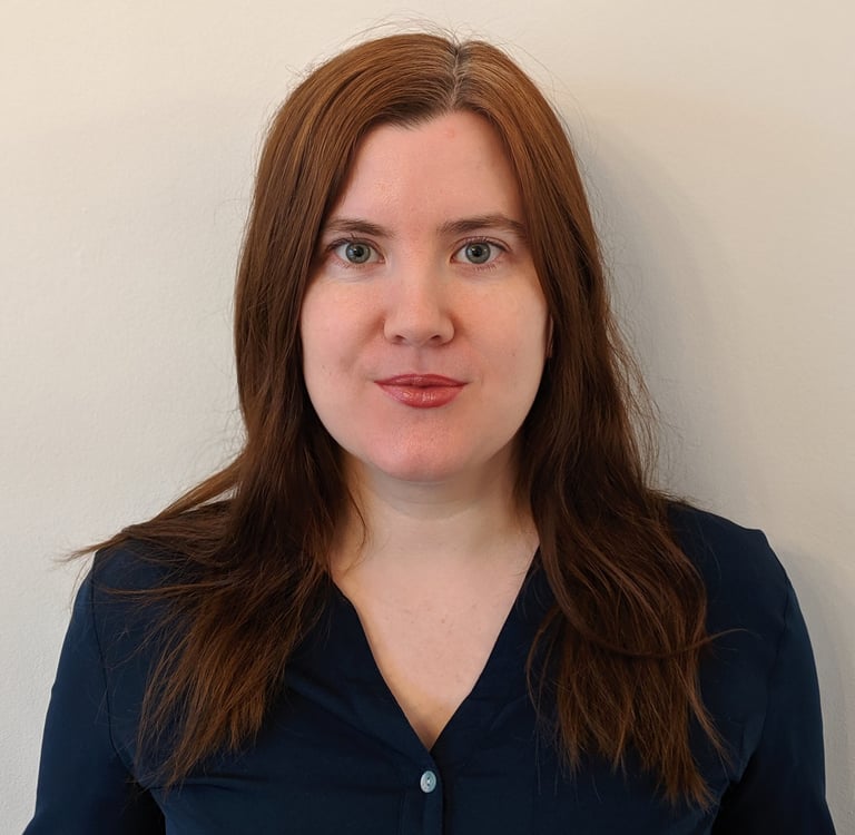 Adept Mediation professional female mediator smiling and looking directly at a client