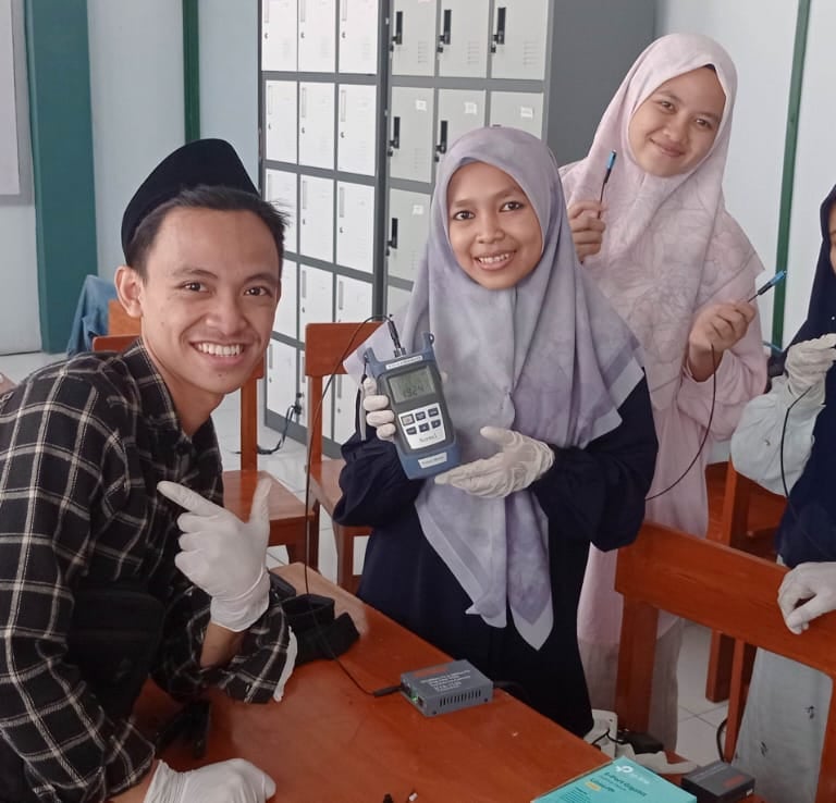 a group of people standing around a table