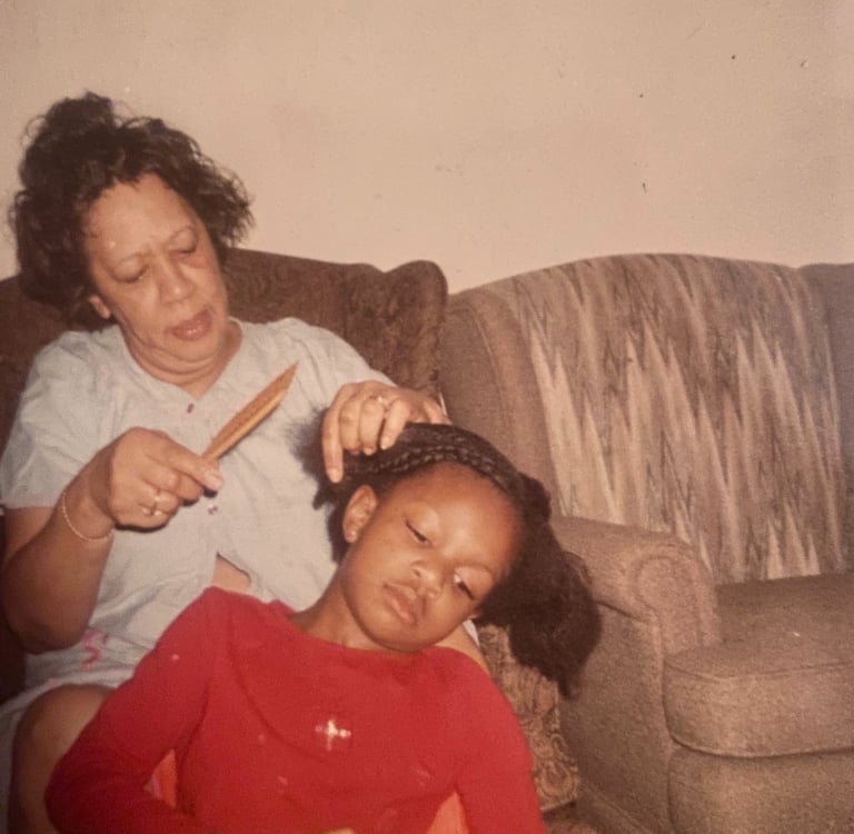 Granny braiding my hair while I braid a doll's hair
