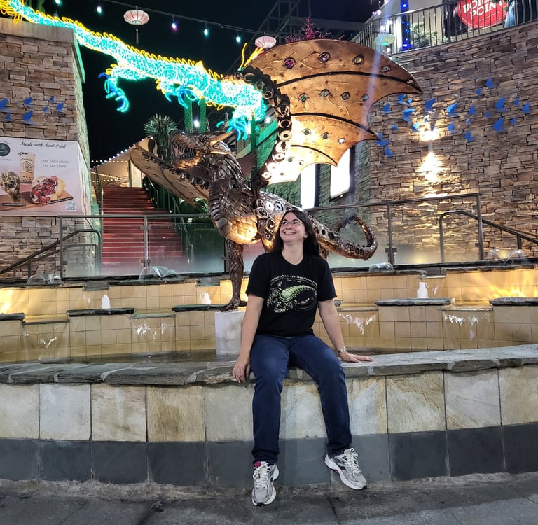 Andrielle with dragon statue