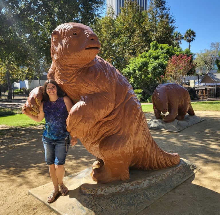 Andrielle with giant ground sloth statue