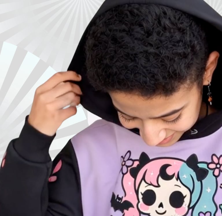 a young girl with a black hair and a pastel goth hoodie