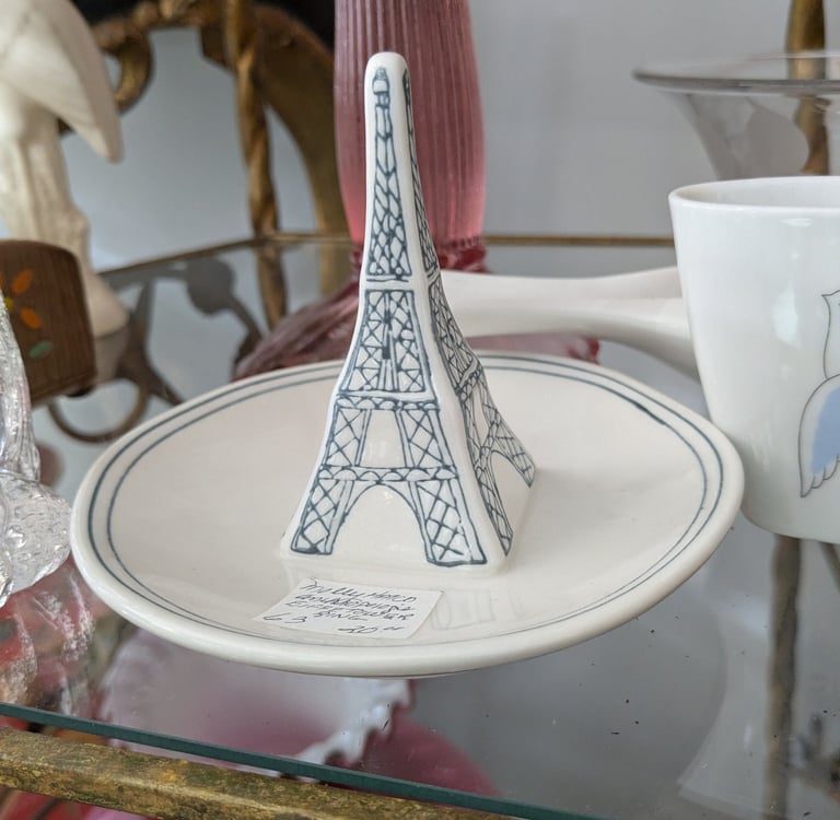 a plate with a small Eiffel tower on it