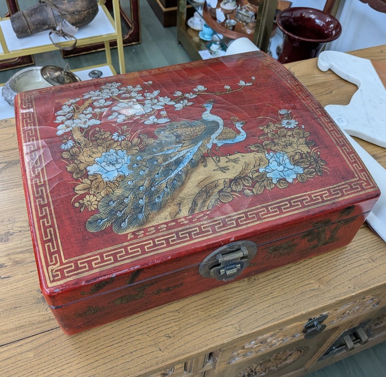 a red box with a bird on it (Asian)