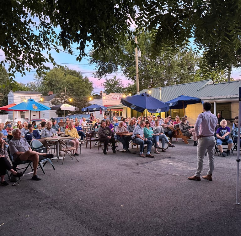 a man standing in front of a crowd of people