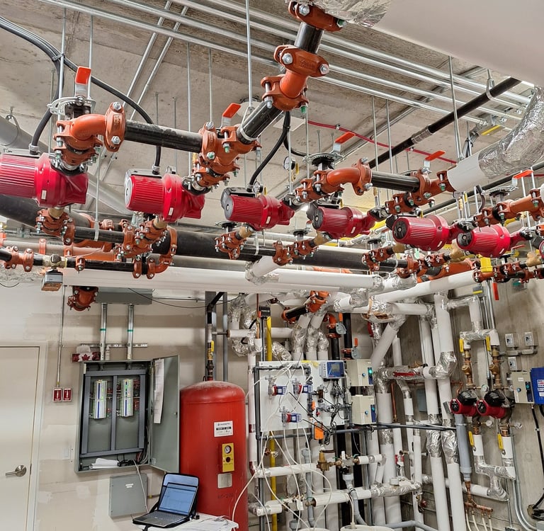 A commercial building mechanical system with HVAC controls