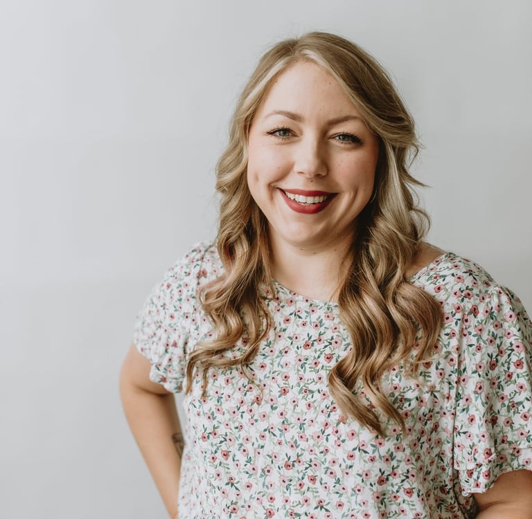 a woman smiling with blonde hair