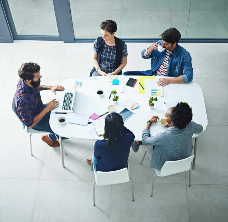 Engineering and business team meeting to discuss product integration and development planning