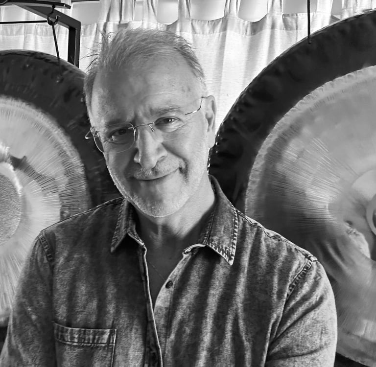 Dr Mike Levy portrait with gongs
