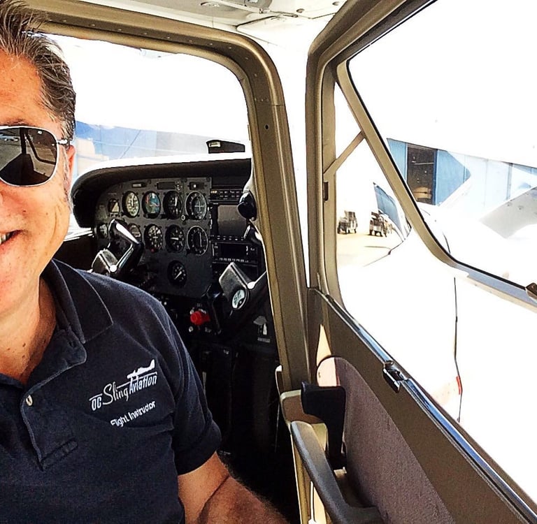 A photo of Marc Lee in front of the cockpit of his Cessna 172