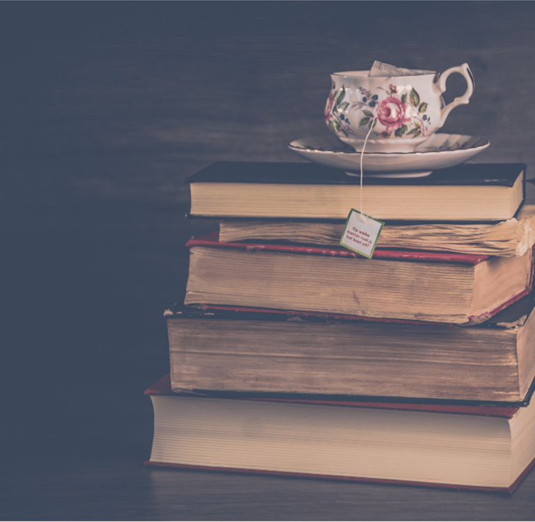 Stack of Books with Tea - Vastly Epic Publishing