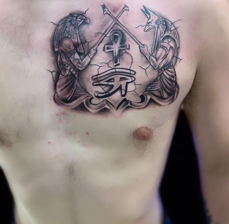 Anubis tattoo in black and grey on chest — Hurghada Tattoo Studio