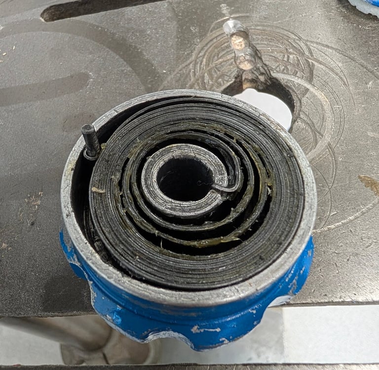 Original quill spring housing with a modern spring fitted, too tight to actually function.