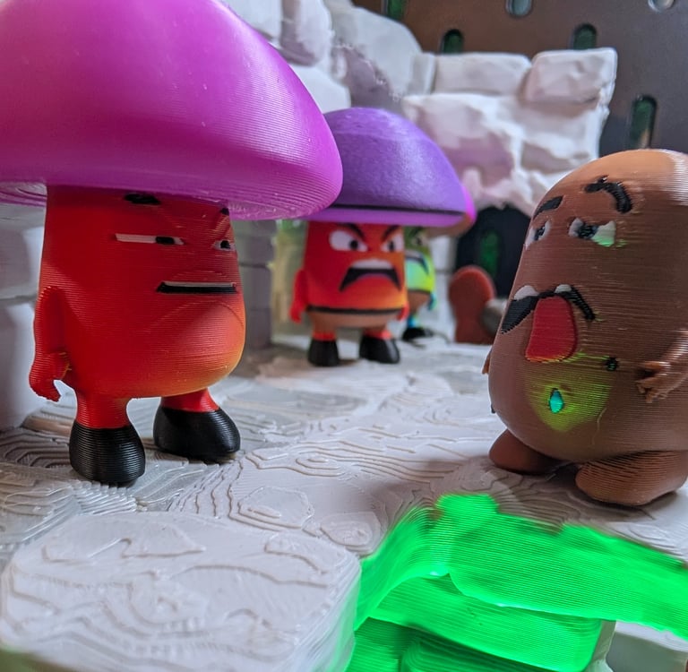 A bemused Shrooman looks on at an extremely stupid potato boy. Original creature creations, 3d print