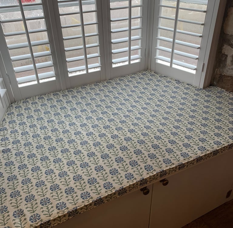 A bespoke window seat cushion shaped to fit an awkward space.