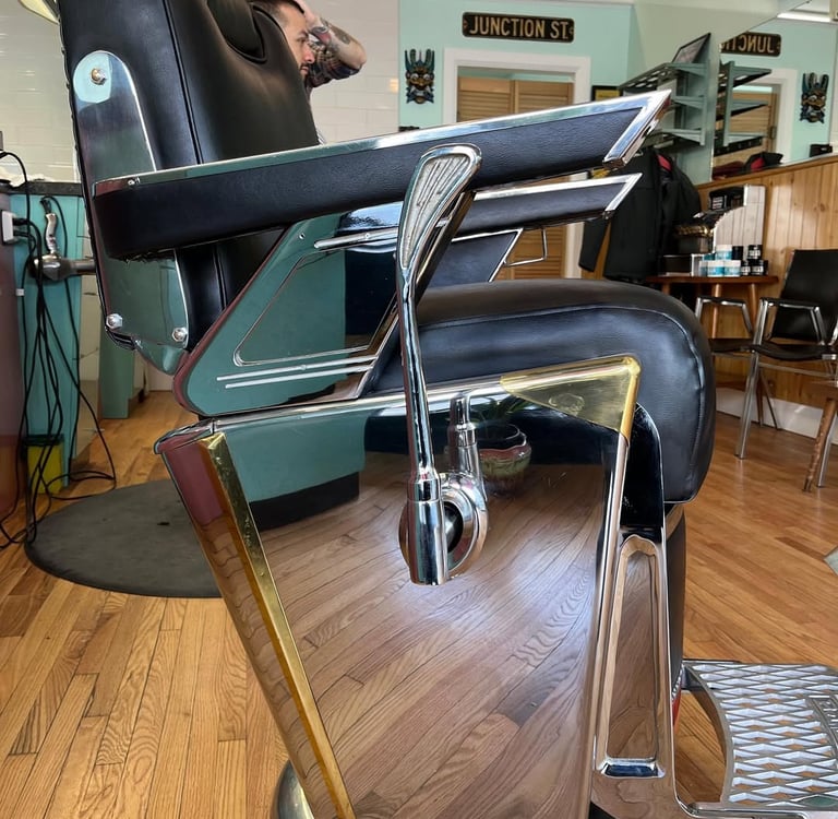 reupholstered vintage Takara Belmont barber chair side view