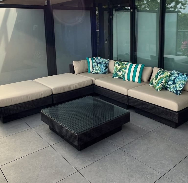corner view of outdoor patio seating with custom cushions and pillows made in Toronto