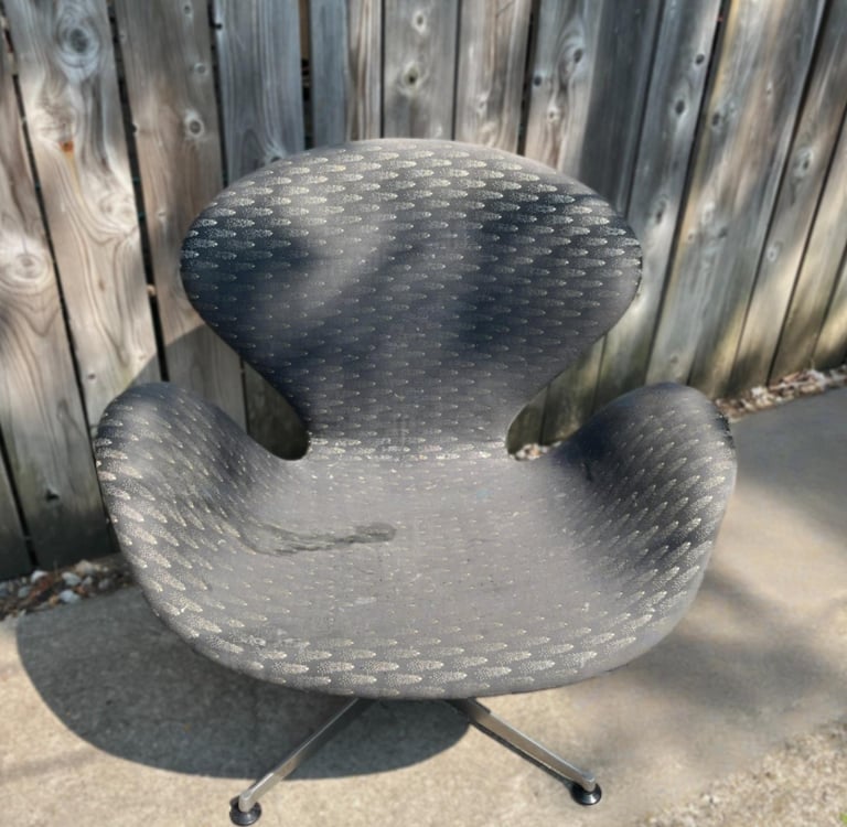 swan chair before with faded and damaged fabric